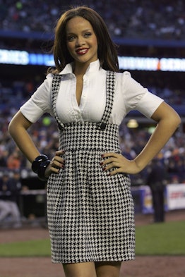 Rihanna smiles after singing the National Anthem before the game between the New York Mets and the N...