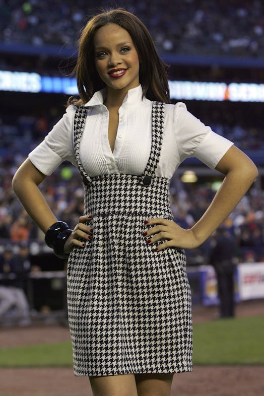 Rihanna smiles after singing the National Anthem before the game between the New York Mets and the N...