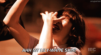 A GIF of a child yelling 'AHH MY LILY-WHITE SKIN!'