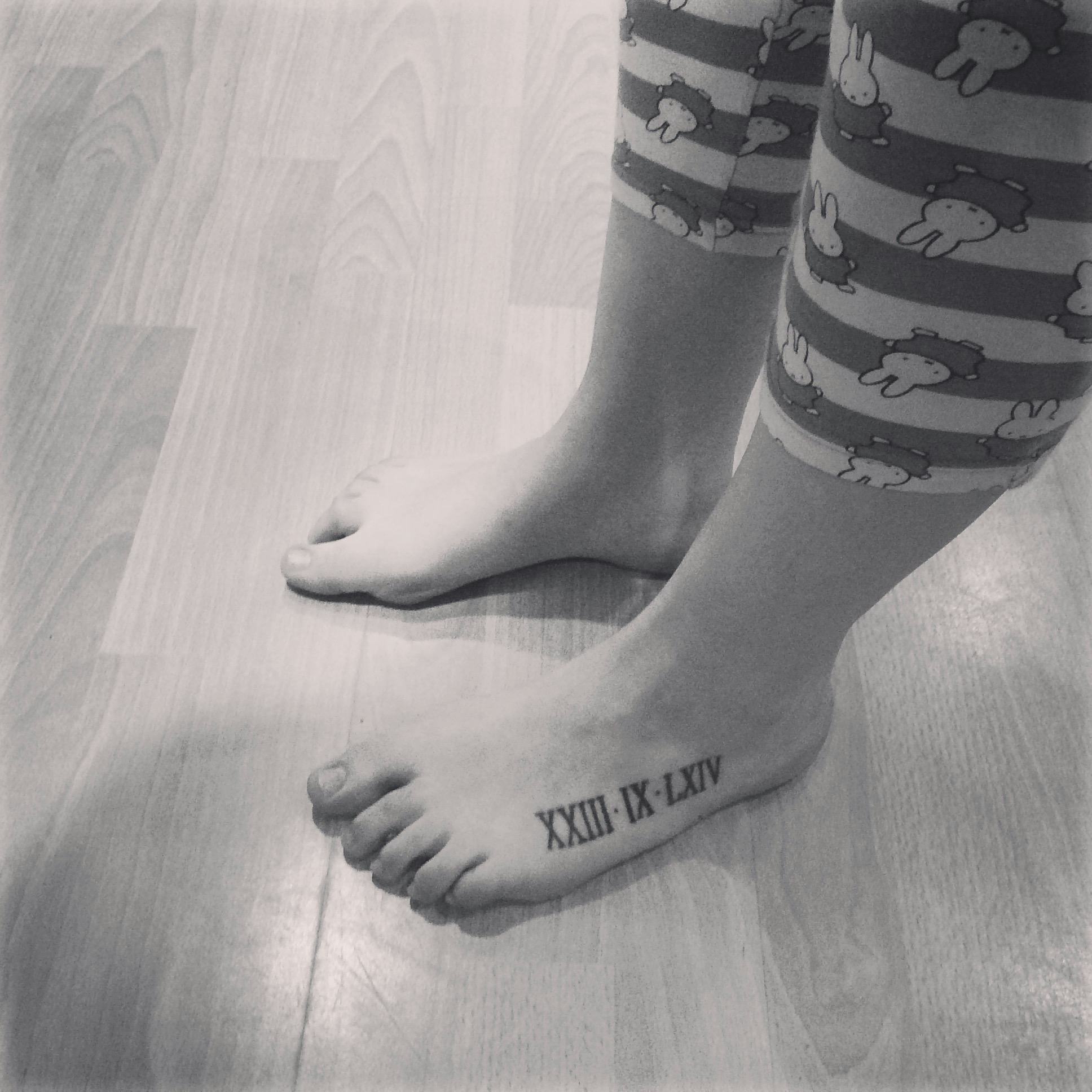 roman numeral tattoos on foot