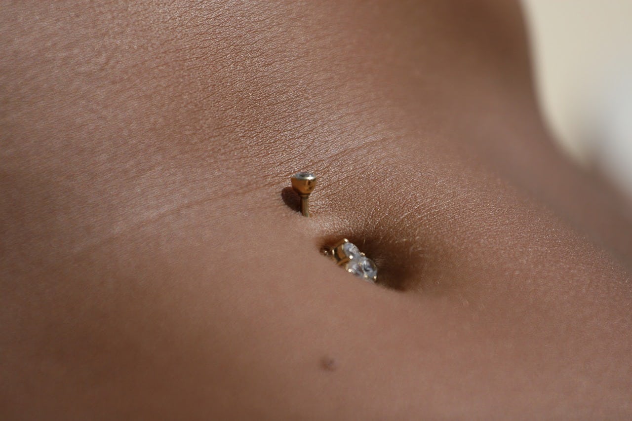 can you pierce scar tissue on your belly button