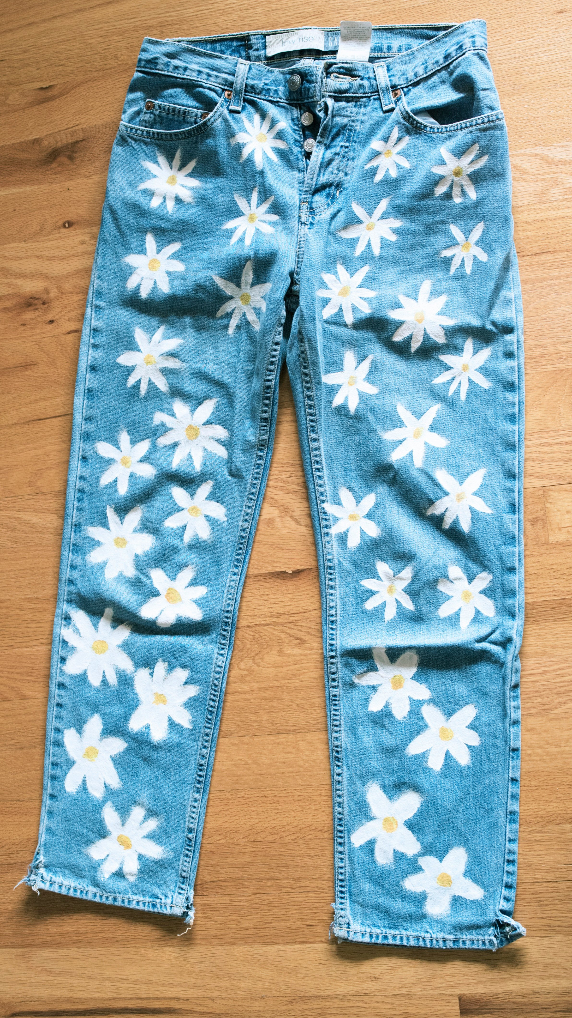 flowers painted on jeans