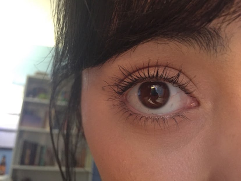 This is how applying waterproof mascara before regular mascara works to keep eyelashes curled.