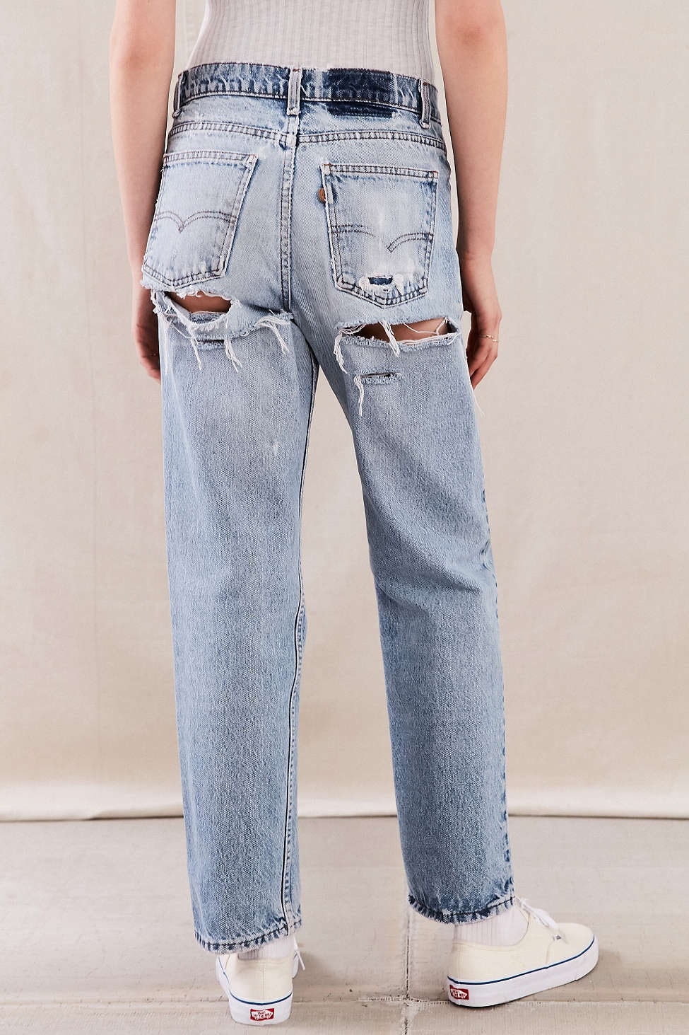 jeans with rips in the front and back