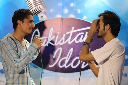 Two men singing at "Pakistan Idol"