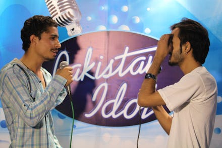 Two men singing at "Pakistan Idol"