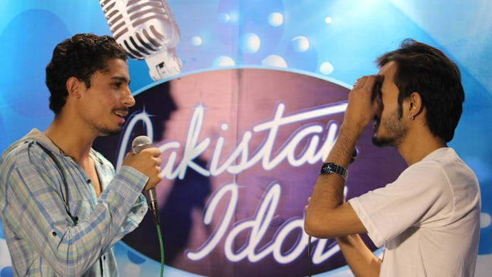 Two men singing at "Pakistan Idol"