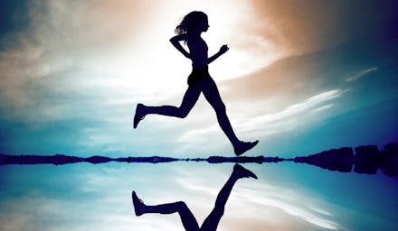 A woman running with sky in background