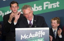 Terry McAuliffe Virginia's Democratic Governor-Elect standing behind a podium giving a speech
