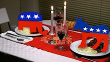 A thanksgiving dinner with the mascots of the two political parties on the plates