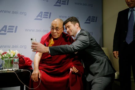Dalai Lama posing for a selfie with Alek Boyd