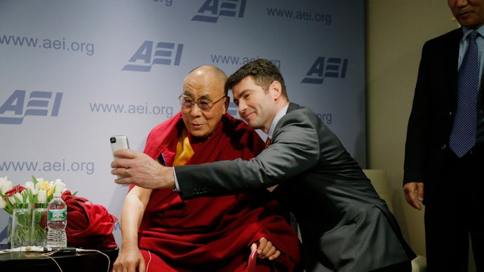 Dalai Lama posing for a selfie with Alek Boyd