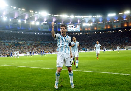 Messi celebrating after scoring a goal at the 2014 World Cup 