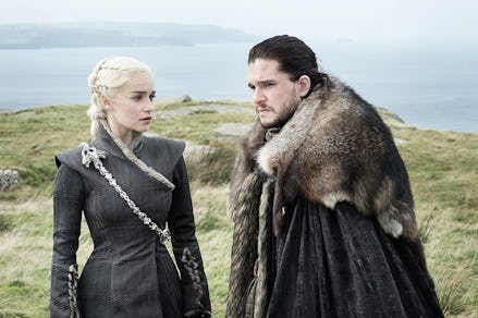 Jon Snow and Daenerys Targaryen standing at a hill top next to the ocean
