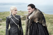 Jon Snow and Daenerys Targaryen standing at a hill top next to the ocean