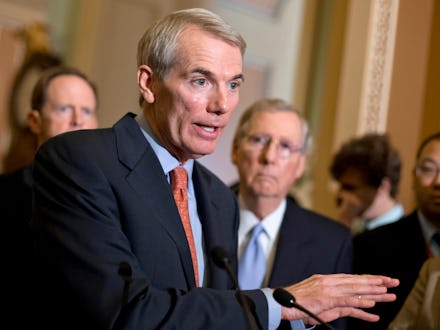 Rob Portman at the forefront talking to the press and Mitch McConnell in the background