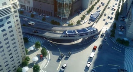 A futuristic bus that lets cars drive through it from an aerial view