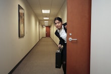 A business woman leaving her office