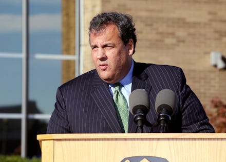Chris Christie delivering a  speech in a striped suite and green tie