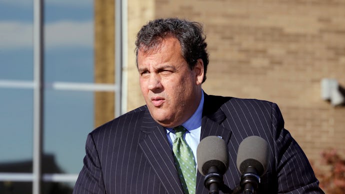 Chris Christie delivering a  speech in a striped suite and green tie