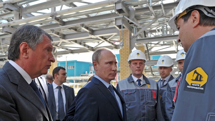 Vladimir Putin talking with oil workers