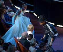 Pharrell dancing with celebrities in the crowd to 'Happy' during his performance