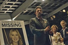 Ben Affleck in a scene in Gone Girl talking into a microphone