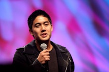 One of the Asian-American kings of the internet, Ryan Higa holding a microphone