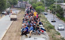 A group of immigrants on the roof of a moving train