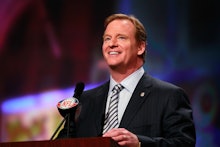 NFL Commissioner Roger Goodell speaking into a microphone 
