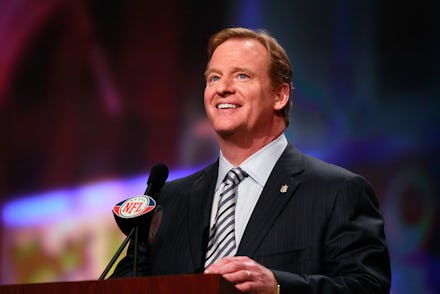 NFL Commissioner Roger Goodell speaking into a microphone 