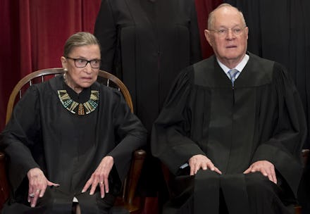 Anthony M. Kennedy and Ruth Bader Ginsburg sitting in next to each other in court attire 