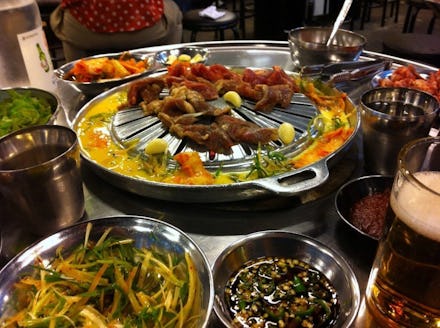Thanksgiving spread served in metal dishes on a metal tray