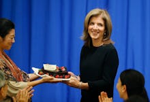 Caroline Kennedy as the first female U.S. ambassador to Japan receiving a welcome gift