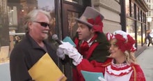 Amy Poehler and Billy Eichner in their viral video of the day interviewing a man in a holiday ambush