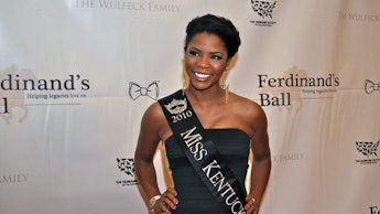 Former Miss Kentucky winner Djuan Keila Trent, in a strapless black dress and her "Miss Kentucky" sa...