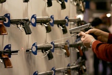 A firearm shop wall full of guns 