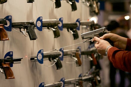 A firearm shop wall full of guns