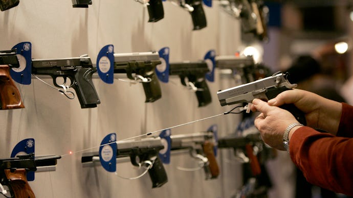 A firearm shop wall full of guns 