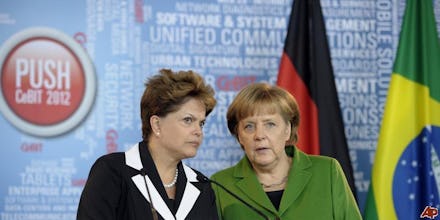 Dilma Rousseff and Angela Merkel's having a discussion, after issues of NSA spying on Brazil and Ge...