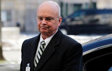 Michael Hayden walking in a formal suit