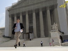 A man walking out of the SCOTUS building