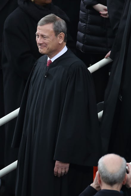 Chief Justice John Roberts standing and smiling
