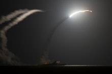 The guided-missile cruiser USS Philippine Sea launching a Tomahawk cruise missile in the Arabian Gul...
