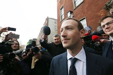 Mark Zuckerberg in a suit talking to the press about FTC and violation of user privacy