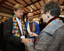 Reverend Frank Schaefer who officiated his gay son's wedding talking to another reverend 