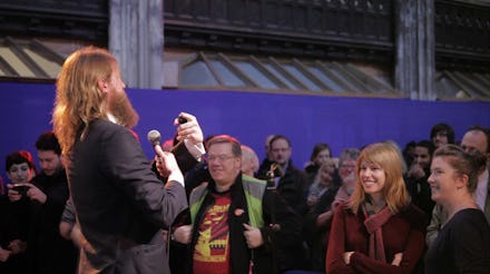 A man speaking to a crowd at an Atheist Mega-Church