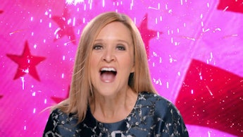 Samantha Bee yelling excitedly in front of a pink background with stars and other shapes