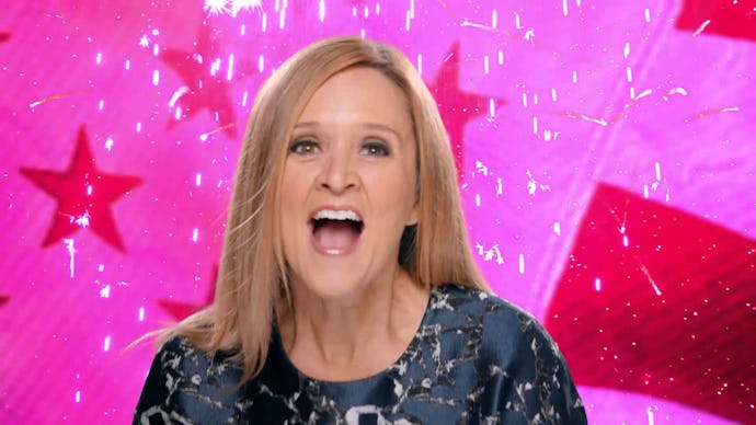 Samantha Bee yelling excitedly in front of a pink background with stars and other shapes