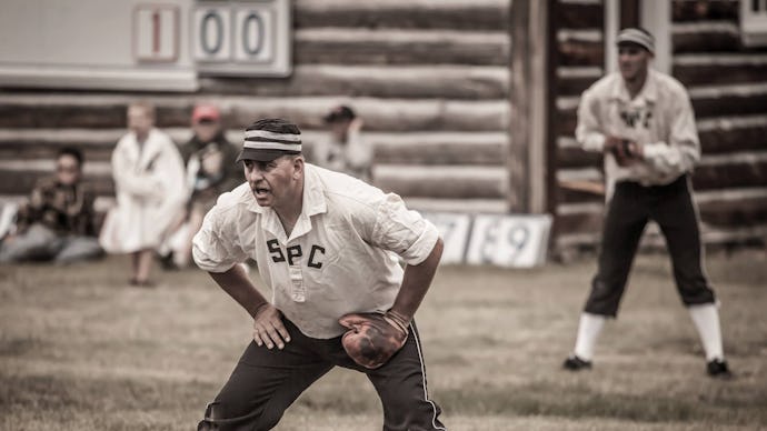 A man in a 19th century-inspired baseball uniform playing in the Gold Rush Days tournament